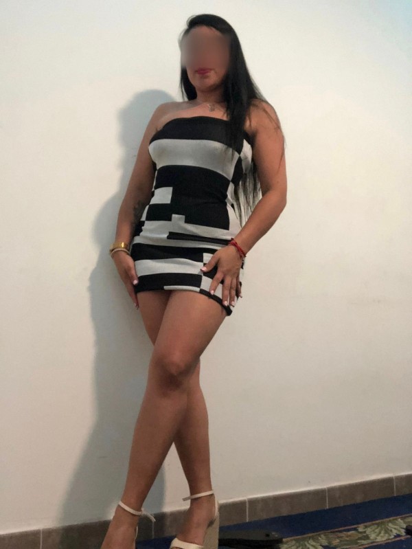 Complaciente colombiana por palma